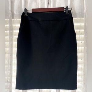 Express black pencil skirt - knee length, slight slit in the back - has pockets